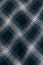 Close-up of a blue and white checkered fabric pattern. Made of deadstock cotton fabric