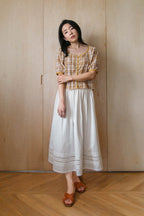 Deadstock cotton A-line skirt with scalloped lace hem, styled full length