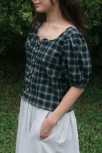 Palmier blouse with sweetheart neckline and shell buttons, side view