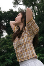 Close-up of clustered pintucks on cotton-linen puff sleeve blouse